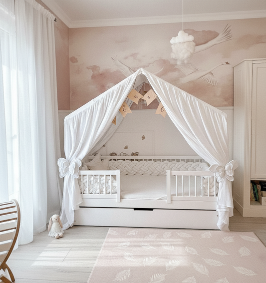 Elegant handmade muslin princess bed canopy in soft pink, draped over a kids’ house bed with fairy lights and pillows.